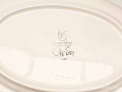 Elegant hand-painted oval plate from Schramberg, model number 4688, perfect for collectors.