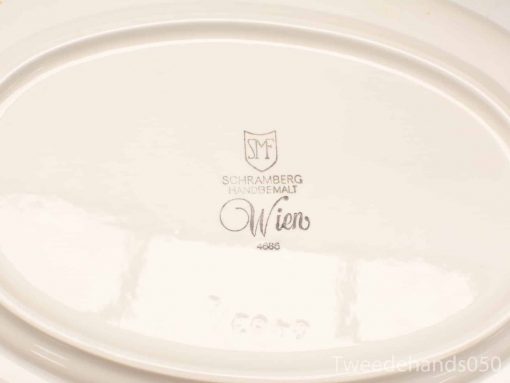 Elegant hand-painted oval plate from Schramberg, model number 4688, perfect for collectors.