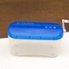 Compact blue mini paper shredder with transparent design, ideal for home or office use.