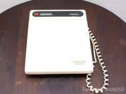 Tefal bathroom scale: modern design with retro coiled cord and sleek digital display.