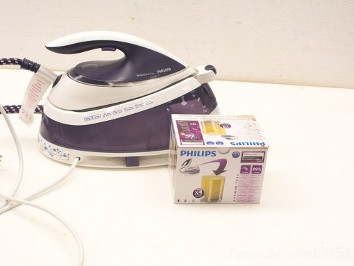 Philips steam iron with ergonomic design and accessories for efficient garment care and wrinkle removal.