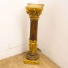 Elegant vintage column with intricate details and gilded accents, perfect for enhancing any space.