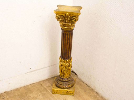 Elegant vintage column with intricate details and gilded accents, perfect for enhancing any space.