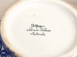 Antique porcelain plate with elegant glaze and unique handwritten inscription, ideal for collectors.