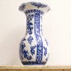 Elegant ceramic vase with intricate blue patterns, perfect for decoration or floral arrangements.