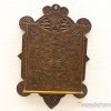 Intricate handcrafted wooden wall shelf with ornate carvings and rich dark finish.