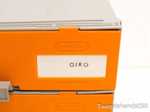 Modern stackable storage boxes in light gray and vibrant orange for efficient organization.