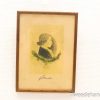 Vintage profile portrait of a young person with botanical embellishments and a warm wooden frame.
