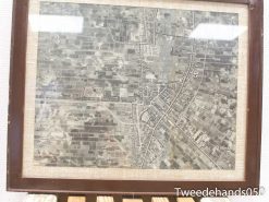 Vintage aerial map showcasing fields, roads, and community areas in historical gray and brown tones.