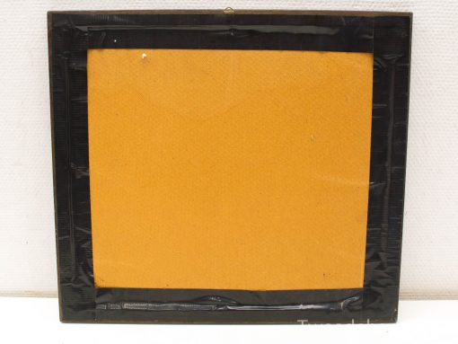 Minimalist black frame with vibrant mustard yellow backing, ideal for showcasing art or photos.