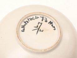 Elegant handmade ceramic bowl by Whistable Potters, featuring unique inscriptions and a glossy finish.