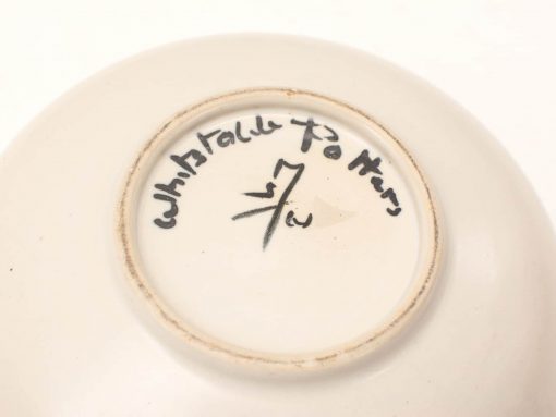 Elegant handmade ceramic bowl by Whistable Potters, featuring unique inscriptions and a glossy finish.