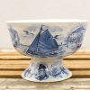 Vintage ceramic bowl with sailboat illustrations, perfect for nautical decor or everyday use.
