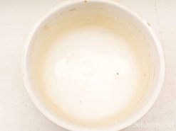 Elegant cream-colored handmade ceramic bowl, perfect for serving a variety of dishes.