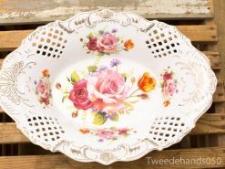 Elegant porcelain serving dish with vibrant rose motif and gold accents, perfect for any occasion.