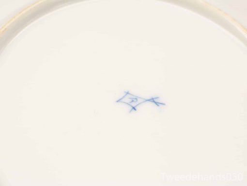 Elegant porcelain plate with gold rim and blue makers mark, ideal for collectors.