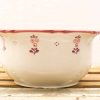 Elegant vintage ceramic bowl with hand-painted floral design, perfect for decor or serving.
