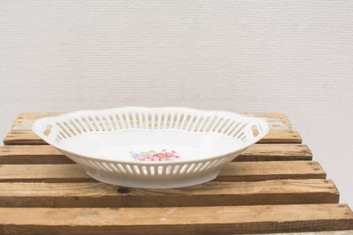 Elegant vintage porcelain dish with floral design, perfect for serving and decoration.