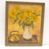 Vibrant sunflowers in an elegant white vase, radiating warmth and joy in a serene setting.