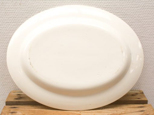 Elegant vintage white serving platter, perfect for special meals and gatherings.