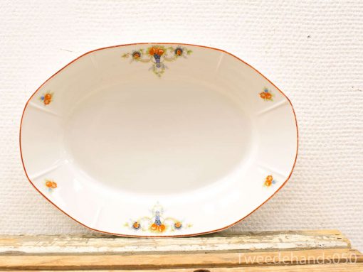 Elegant vintage oval serving platter with delicate orange and blue floral motifs.