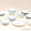 Elegant porcelain dinnerware set with floral designs and blue accents for special occasions.