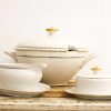 Elegant vintage porcelain dinnerware set with gold accents for luxurious dining experiences.
