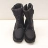 Stylish waterproof black high winter boots with padded insulation for comfort and traction.
