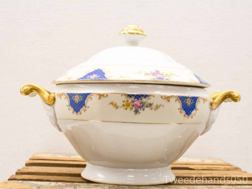 Elegant porcelain soup tureen with gold accents and vibrant floral motifs for formal dining.