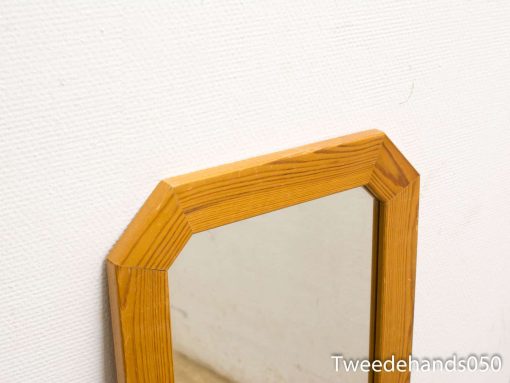 Contemporary pine-framed mirror with a sleek design, perfect for modern interiors.