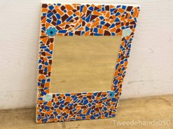 Colorful mosaic mirror with floral accents, perfect for enhancing any rooms decor.