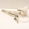 Vintage adjustable desk lamp with white shade, exuding retro charm and character.