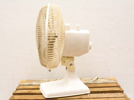 Vintage cream table fan with stylish design, perfect blend of nostalgia and functionality.