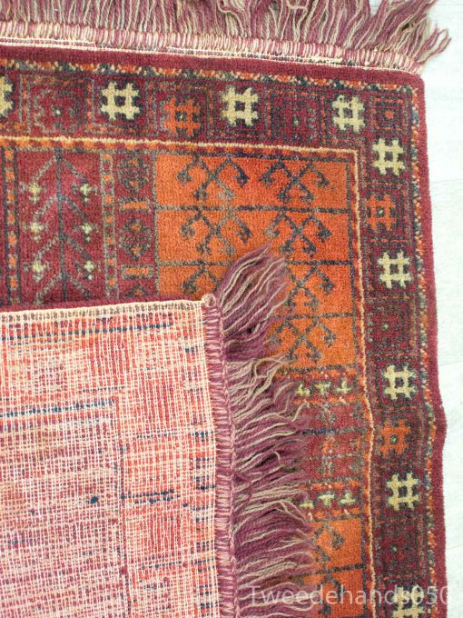 Layered vintage rugs showcasing vibrant patterns and colors, perfect for enhancing any interior style.