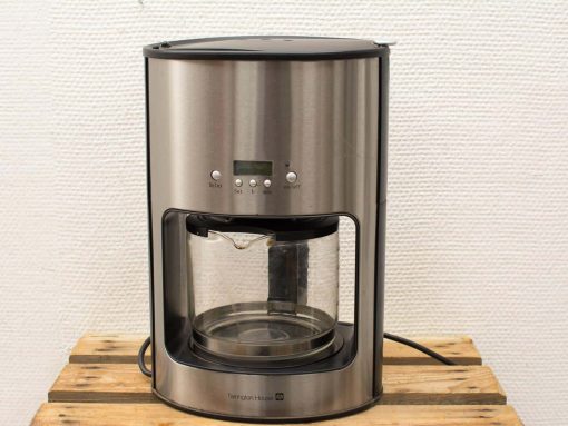 Sleek stainless steel coffee maker with digital display and elegant glass carafe for effortless brewing.