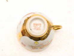 Elegant Chinese teacup with vibrant floral design and gold trim, perfect for collectors.