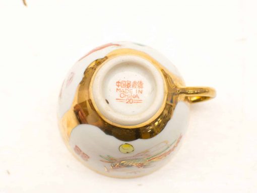 Elegant Chinese teacup with vibrant floral design and gold trim, perfect for collectors.
