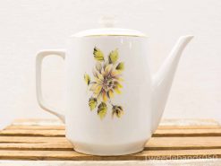 Elegant porcelain teapot with floral design and gold trim for charming tea settings.