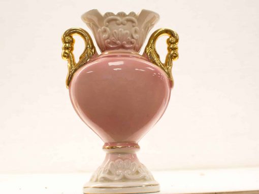 Elegant pink vase with golden handles, featuring a ruffled lip and refined design.