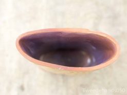 Elegant terracotta vase with glossy purple interior, perfect for decor or functional use.