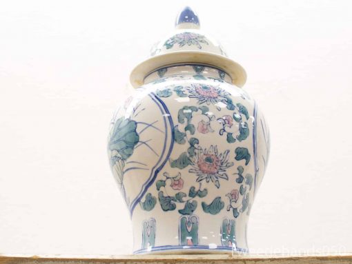 Elegant ceramic urn with lid, adorned with pastel floral designs and intricate craftsmanship.