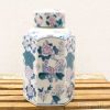 Elegant hexagonal porcelain jar with intricate floral designs in pink and blue tones.