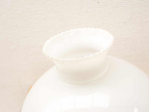 Elegant white ceramic vase with scalloped rim, perfect for flowers or decorative display.