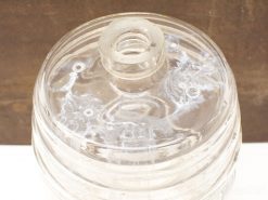 Elegant glass storage jar with lid and pour opening, ideal for kitchen or decor.