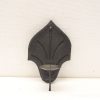 Elegant wrought iron wall candle holder with vintage charm, perfect for enhancing any living space.