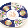 Vibrant handcrafted ceramic plate featuring floral patterns and intricate designs for elegant decor.