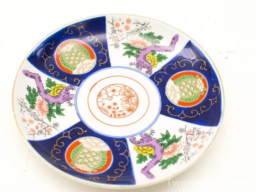 Vibrant handcrafted ceramic plate featuring floral patterns and intricate designs for elegant decor.