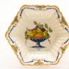 Elegant hexagonal porcelain dish featuring a vibrant fruit design and delicate floral patterns.