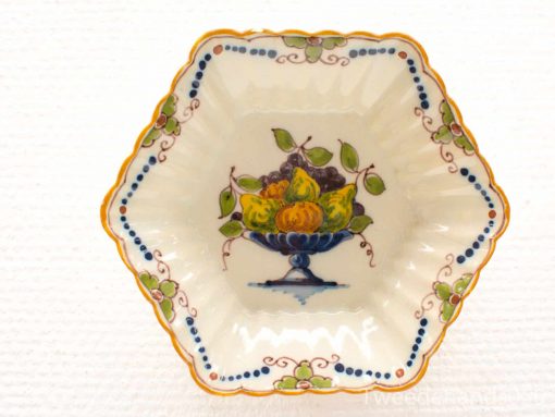 Elegant hexagonal porcelain dish featuring a vibrant fruit design and delicate floral patterns.