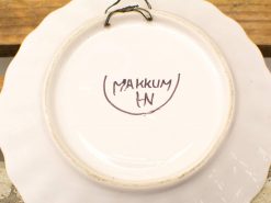 Antique Makkum ceramic plate with scalloped edge, perfect for collectors and home decor.